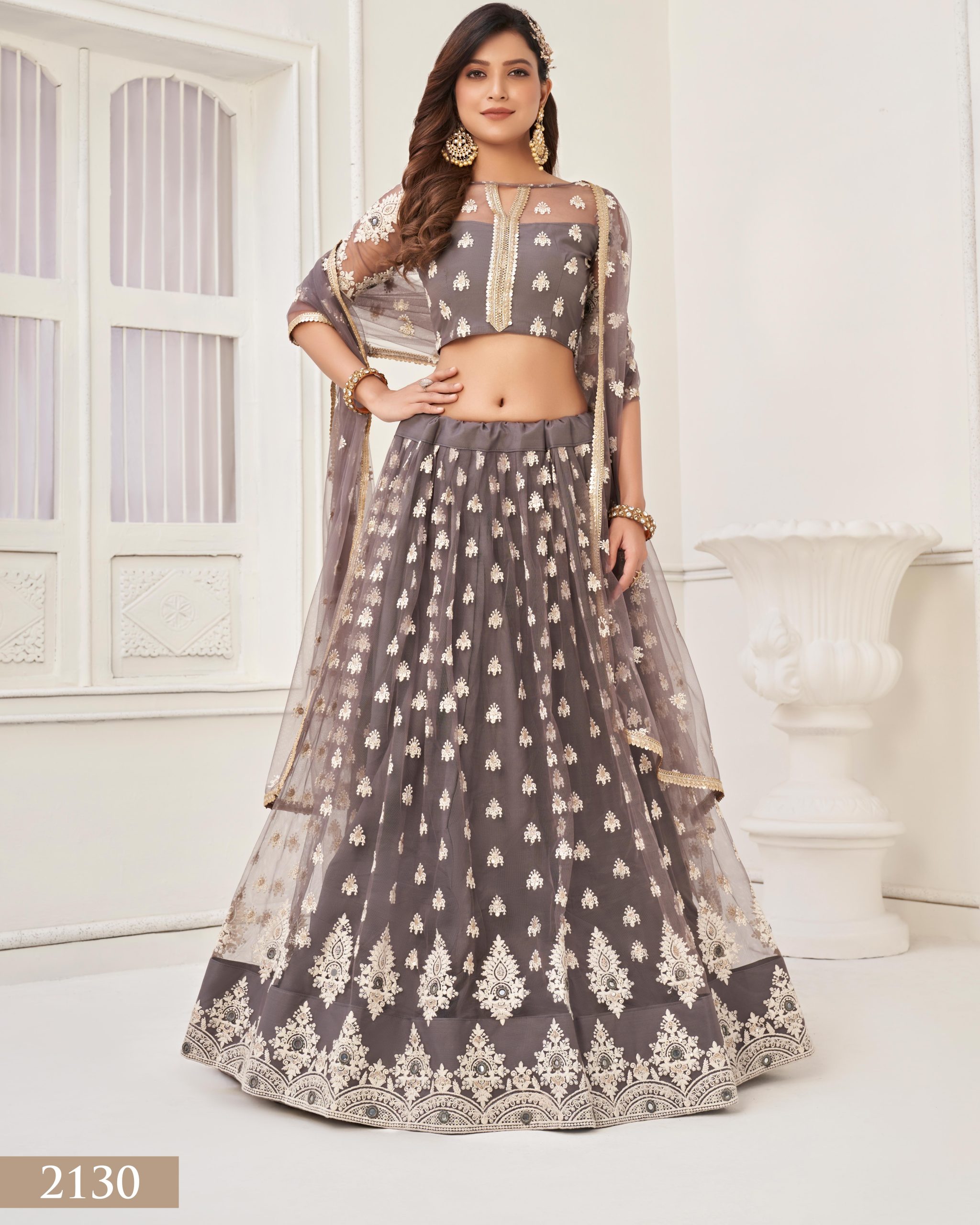 Embrace Grace and Glamour in our Semi-Stitched Designer Butterfly Net Wedding Wear Lehenga Choli Your Perfect Bridal Ensemble