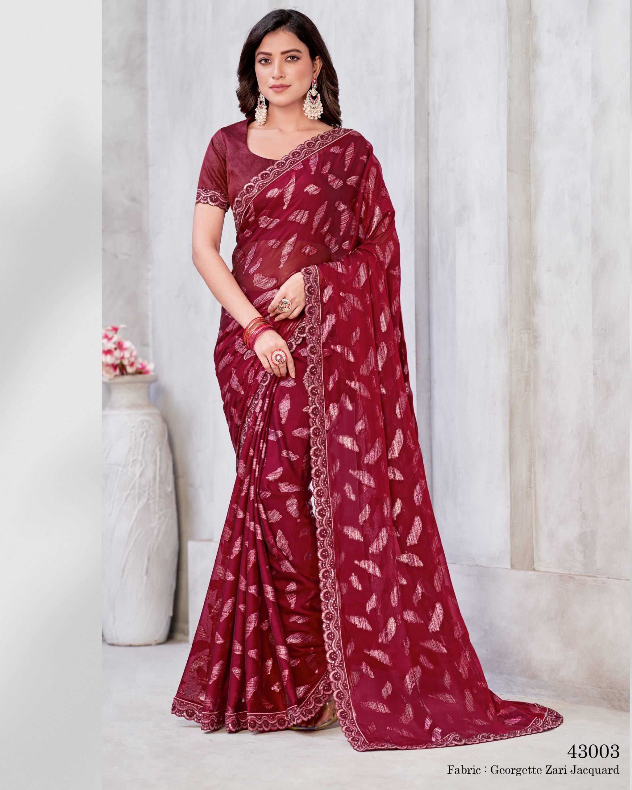 Unleash Elegance With Our Un-stitched Georgette Saree. Adorned In Zari Embroidery, It's A Canvas Of Timeless Art. Complete With A Matching Blouse, Tailor Your Style Effortlessly .