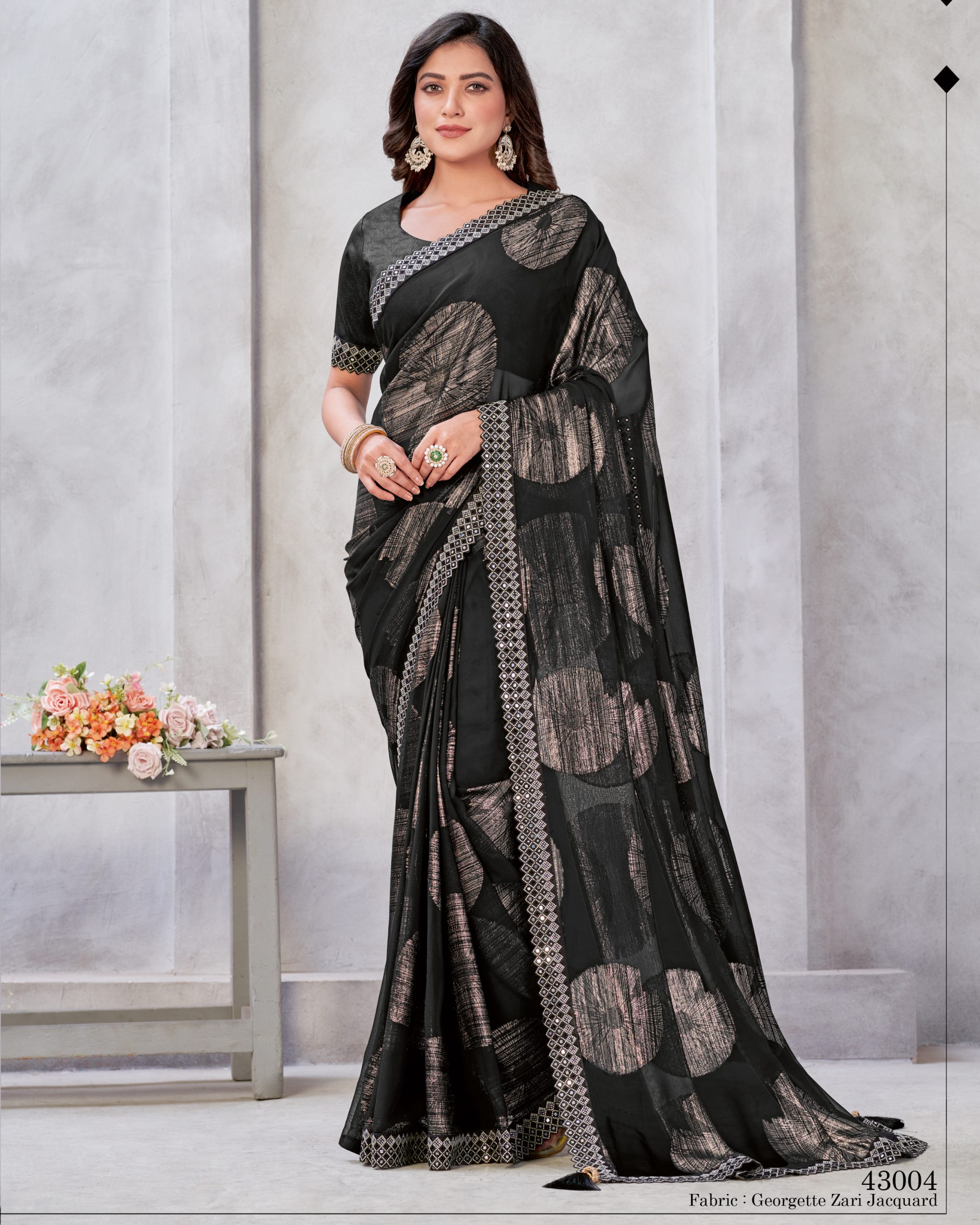Unleash Elegance With Our Un-stitched Georgette Saree. Adorned In Zari Embroidery, It's A Canvas Of Timeless Art. Complete With A Matching Blouse, Tailor Your Style Effortlessly .