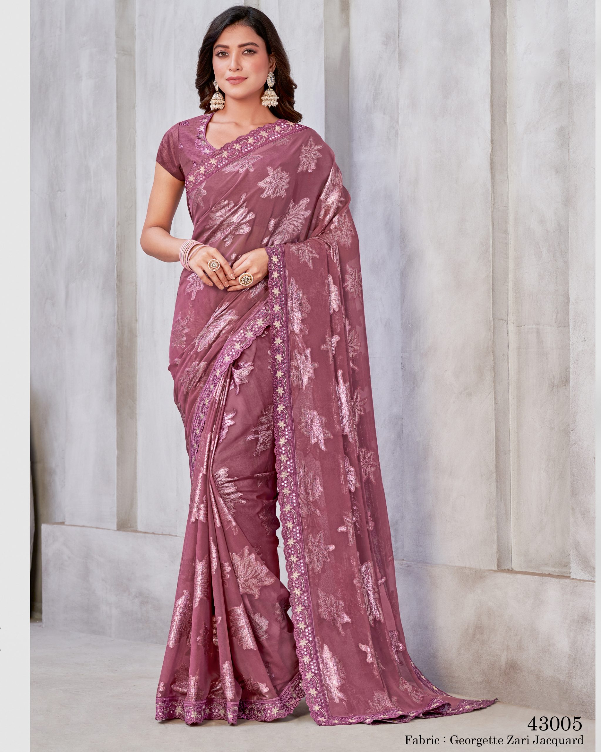 Unleash Elegance With Our Un-stitched Georgette Saree. Adorned In Zari Embroidery, It's A Canvas Of Timeless Art. Complete With A Matching Blouse, Tailor Your Style Effortlessly .