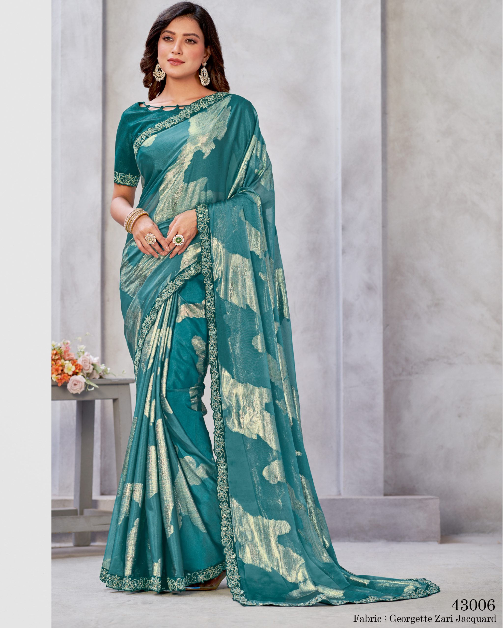 Unleash Elegance With Our Un-stitched Georgette Saree. Adorned In Zari Embroidery, It's A Canvas Of Timeless Art. Complete With A Matching Blouse, Tailor Your Style Effortlessly .